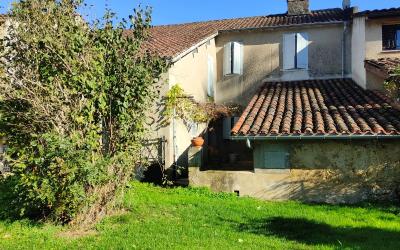 Maison de ville avec garage et jardin